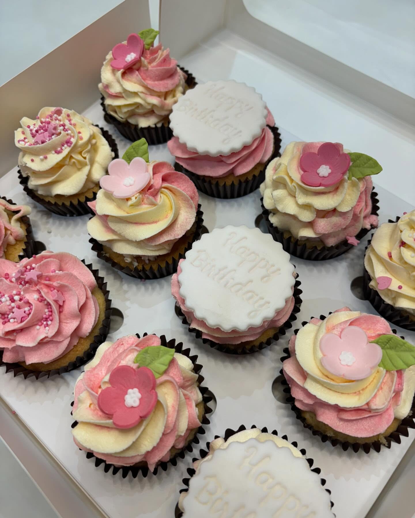 Floral cupcakes with buttercream swirls and Happy Birthday discs